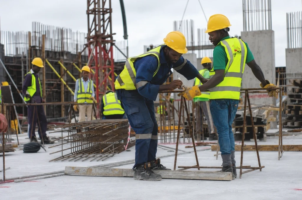 Construction workers installing steel rebar on a commercial construction project