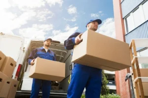 Delivery person carrying packages from a van