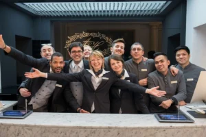 Friendly hotel employees greeting visitors at the reception