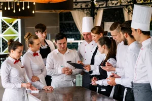 Restaurant employees and chefs preparing for daily operations