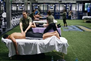 Athlete receiving sports massage therapy from a professional therapist.