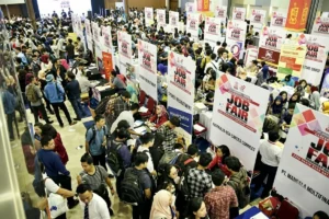 Career fair featuring recruitment booths and applicants