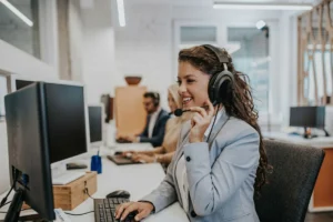 Customer service agent talking to a customer in a call center.