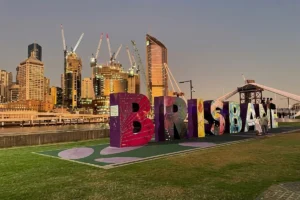 Famous Brisbane sign with park and city backdrop