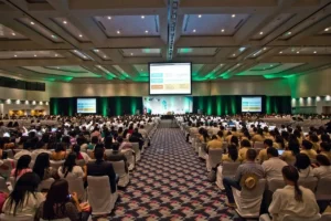 Group of professionals gathered in a conference room for a business meeting.