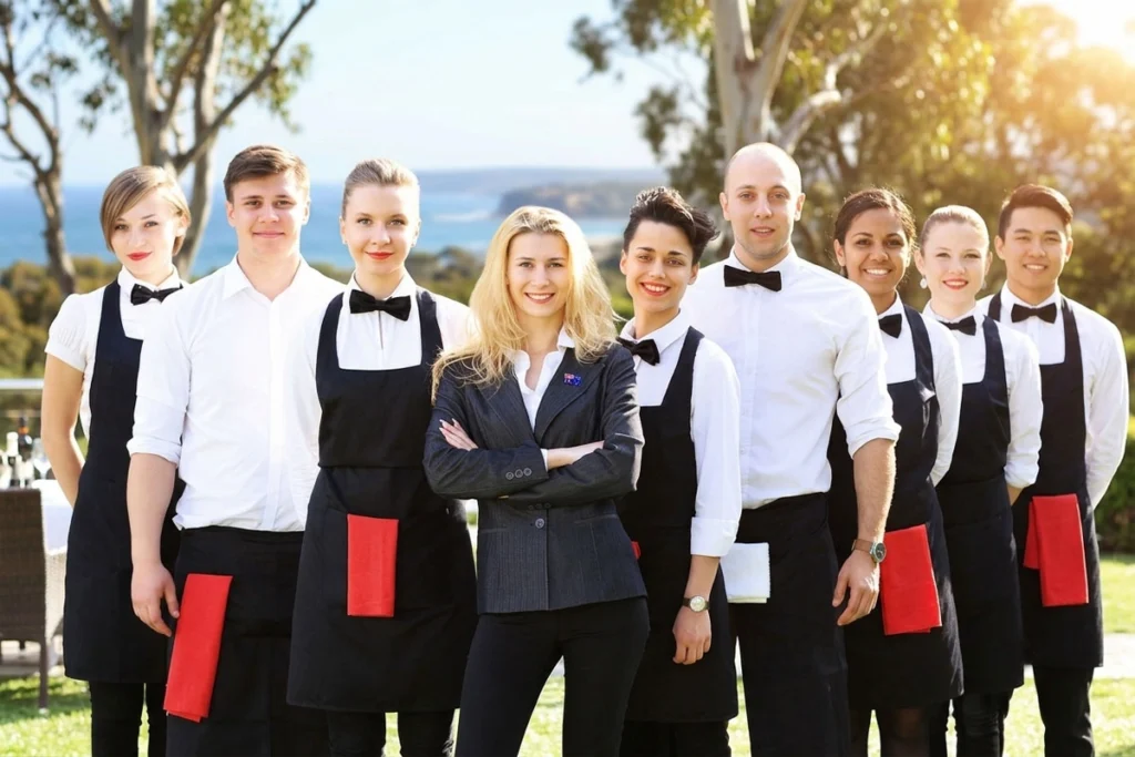 Hospitality team smiling before serving guests.