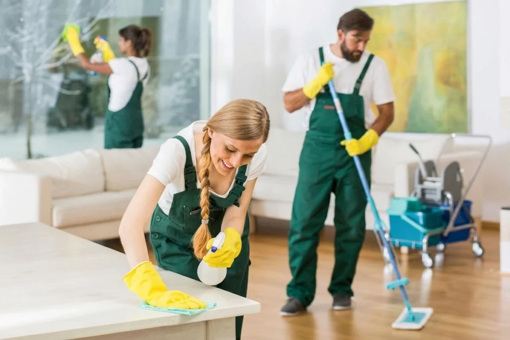 Janitors performing office cleaning duties.