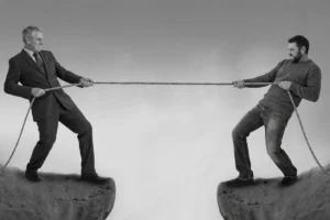 Two people holding a rope with tension between them