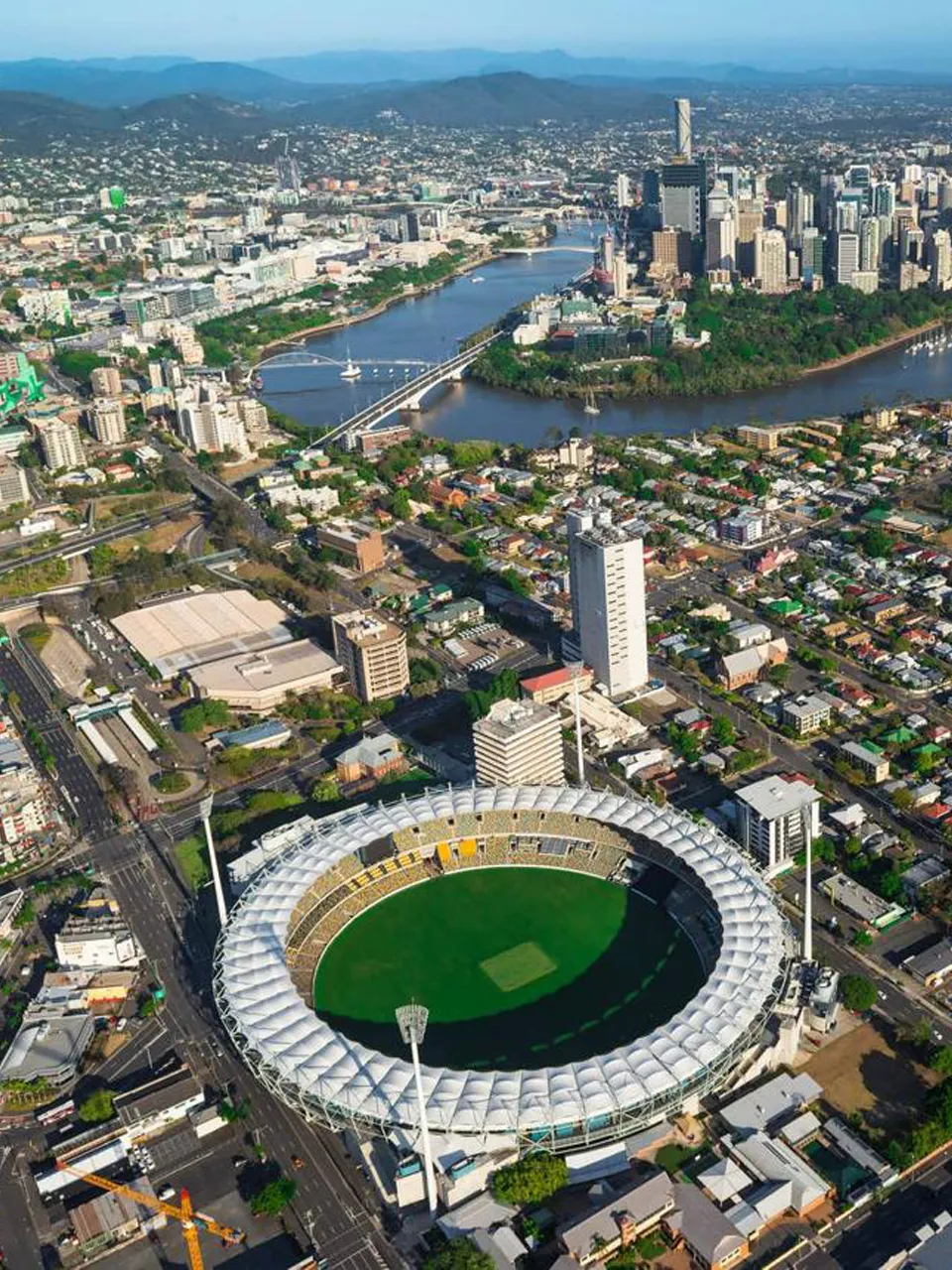 Panoramic Brisbane city view with lake and modern buildings