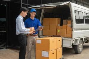 Logistics delivery driver asking a customer to sign for parcel delivery.