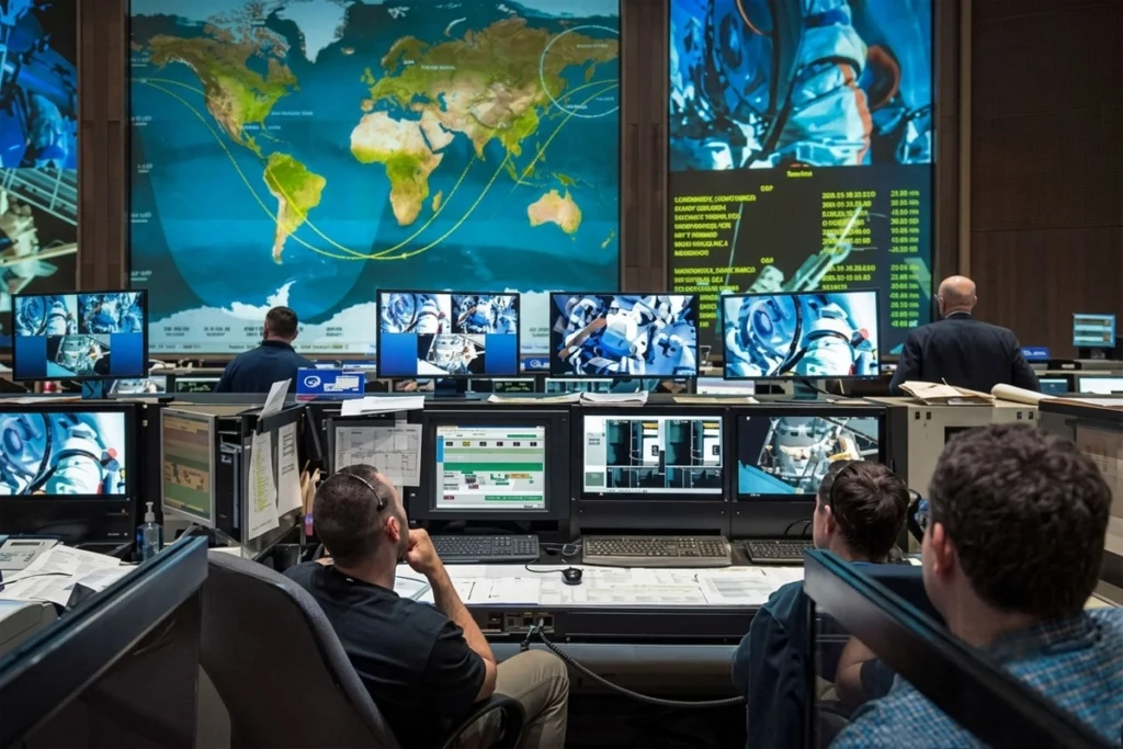 Employee watching live traffic in the big monitor.